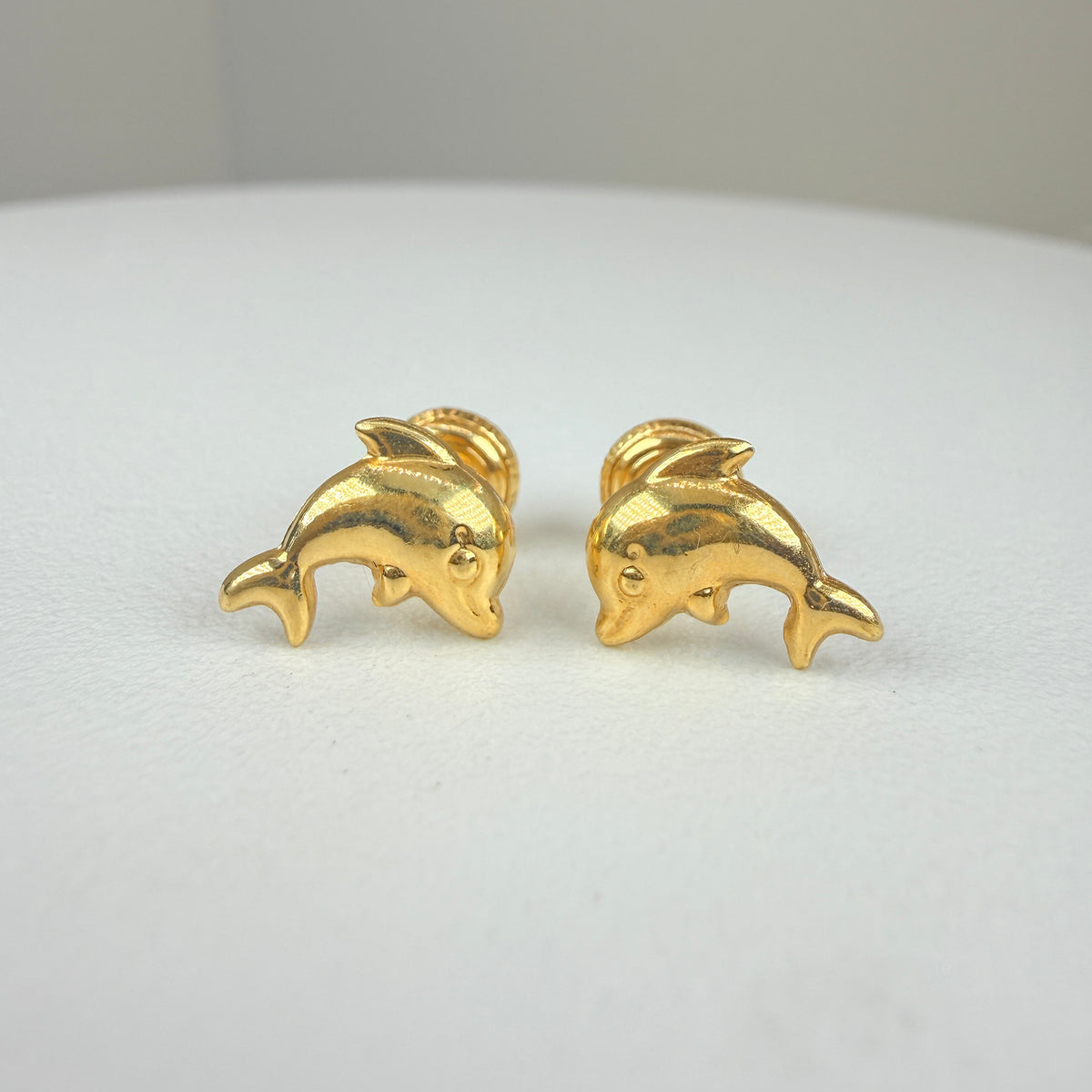 Yellow gold dolphin earring
