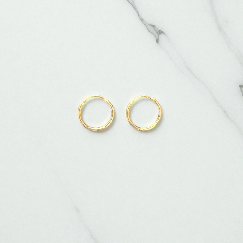 Yellow gold mini hoop earring