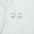 Diamond-cut yellow gold mini hoop earring