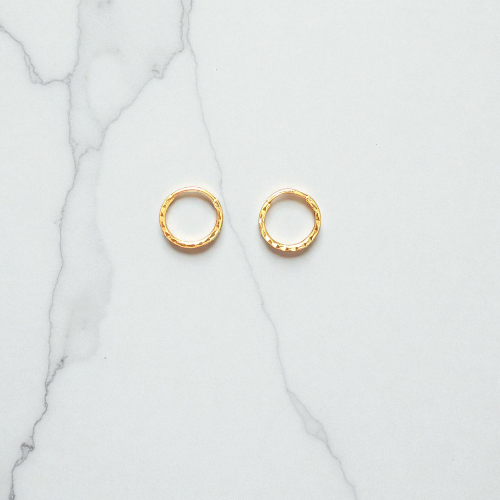 Diamond-cut yellow gold mini hoop earring